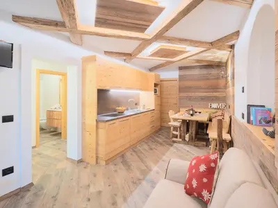 a living room with a couch and a table at CESA MARIN in Campitello di Fassa