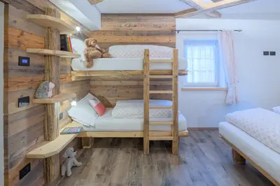 a bunk bed room with two bunk beds at CESA MARIN in Campitello di Fassa
