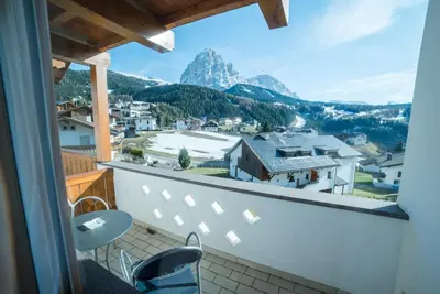 a balcony with a view of a mountain at Hotel Pra Tlusel in Selva di Val Gardena