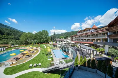 an aerial view of a resort with a swimming pool at Hotel Kronblick in Chienes