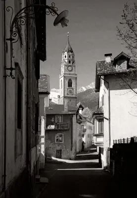 a black and white photo of a building with a clock tower at Space Nr. 11 in Merano