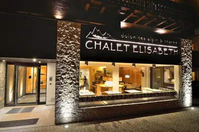 a chatelestation store front with a sign on it at Chalet Elisabeth dolomites alpin & charme in Selva di Val Gardena