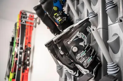 a group of skateboards are hanging on a wall at Cadepunt The Dolomites Lodge in Selva di Val Gardena
