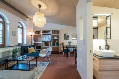 a living room with a sink and a couch and a table at Schloss-Castel Pienzenau - Guestrooms & Apartments - B&B-Hotel & Restaurant in Merano