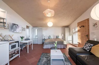a living room with a couch and a bed at Schloss-Castel Pienzenau - Guestrooms & Apartments - B&B-Hotel & Restaurant in Merano