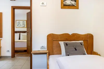 a bedroom with a bed and a mirror at Ritschhof in Laion