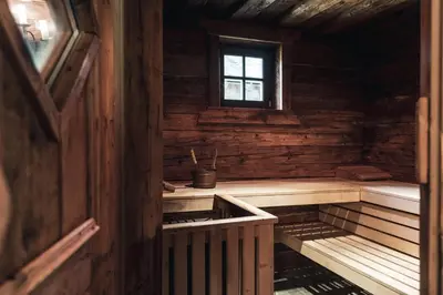 an inside view of a wooden cabin with a window at Hotel Chalet Corso in San Vigilio Di Marebbe