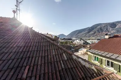 a view from the roof of a town at Stay COOPER l Guesthouse zum Löwen in Merano