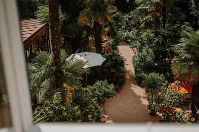 an overhead view of a garden with plants and trees at Ottmanngut Suite and Breakfast in Merano