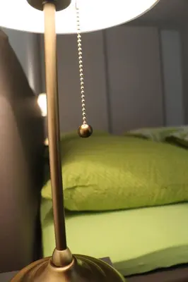 a close up of a lamp with a chain attached to it at Appartment Larcher - Manzoni in Merano