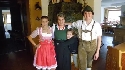 a group of people posing for a picture at Hotel Ciamol in Mazzin