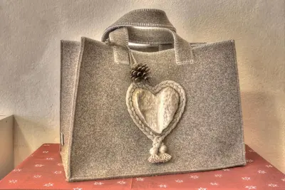 a shopping bag with a heart painted on it at Hotel Luianta in Colfosco