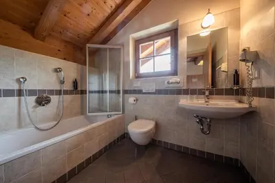 a bathroom with a shower and a sink at Hotel Seerast in Ultimo