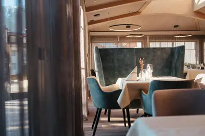 a dining room with a table and chairs at Hotel Gasthaus Post in Campo di Trens
