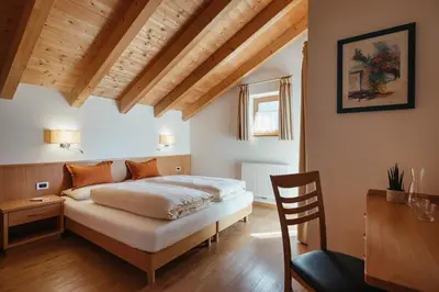 a bedroom with a white bed and a window at Apartment Sotmarin in La Villa