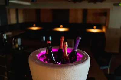 a group of bottles of wine in a barrel at Hotel Sun Valley in Selva di Val Gardena