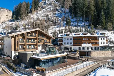 an aerial view of a resort in the mountains at Hotel Sun Valley in Selva di Val Gardena
