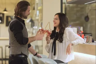 a man and a woman holding glasses of wine at Bonfanti Design Hotel in Chienes