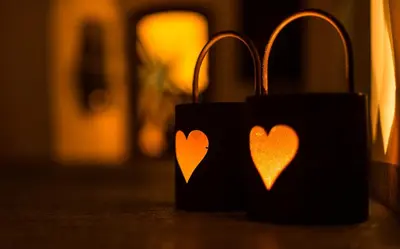 two black wallets with hearts on them on a table at Gasthof Zur Sonne in Laion
