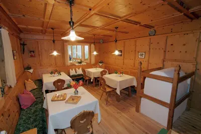 an overhead view of a dining room with tables and chairs at Vitalhotel Rainer in Ultimo