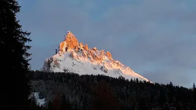 a mountain with the sun shining on it at Apartments Kranebitt in Eggen