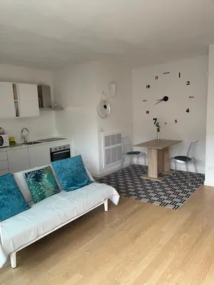 a living room with a couch and a table at Appartamento Ligeia in Bolzano