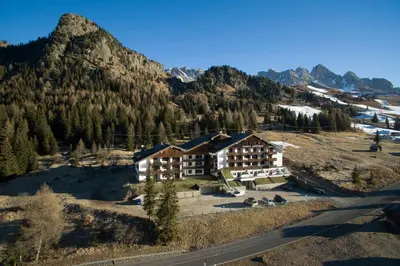 an aerial view of a ski lodge in the mountains at Residence Rododendro in Passo San Pellegrino