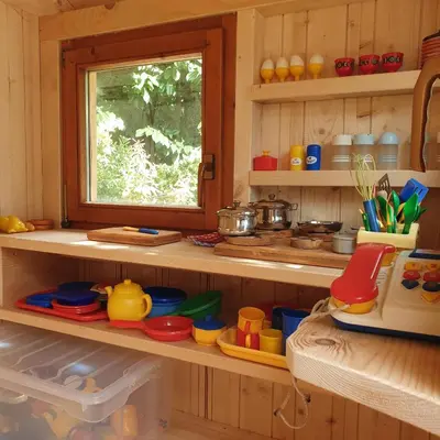 a kitchen with wooden shelves and a window at Haus Hofer *** in Andrian