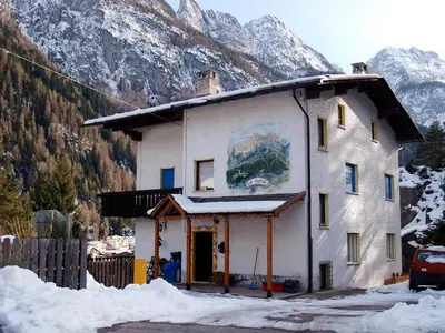 a building with a balcony on top of it at Apartment La Busa-4 by Interhome in Alleghe