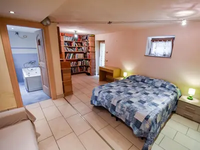 a bedroom with a bed in a room at Apartment La Busa-4 by Interhome in Alleghe
