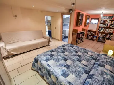 a room filled with book shelves filled with books at Apartment La Busa-4 by Interhome in Alleghe