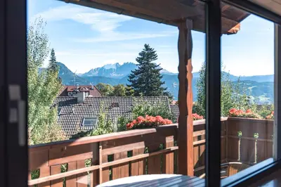 a view from a window of a balcony with mountains at Sonnen Residence in Collalbo
