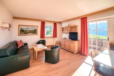 a living room with a couch and a table at Residenz am Kaiserweg in Longomoso