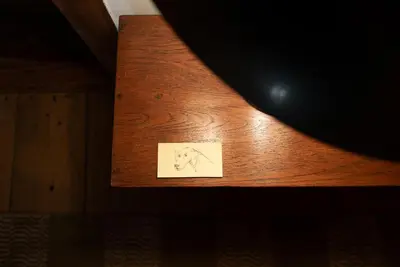 a piece of paper on a wooden table at LA PITA in La Valle