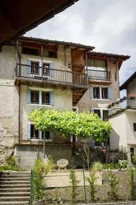 a building with a tree in front of it at LA PITA in La Valle