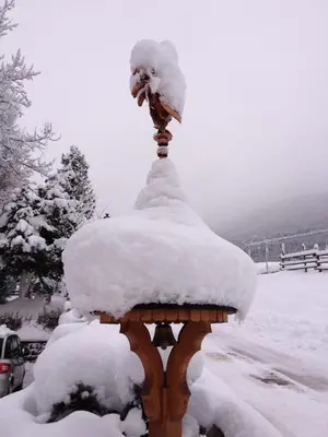 a statue covered in snow on top at Hotel Patrizia Dolomites Glamour in Moena