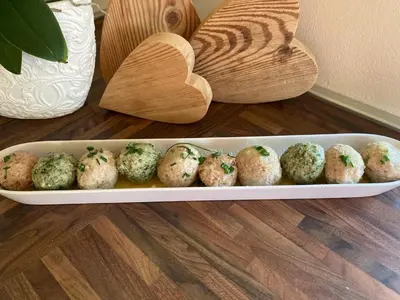 a tray of muffins sitting on a floor with a wooden spoon at Hotel Italia in Castello di Fiemme