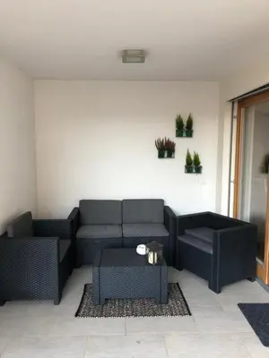 a living room with a couch and a table at Apartment Himmelreich in Brunico