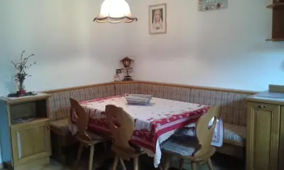 a dining room table with a red and white table cloth at Casa Sicina in Sicina