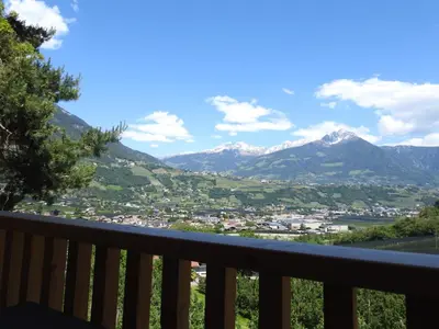 a view of the mountains from the balcony of a house at Birkenhof in Marlengo