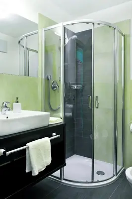 a bathroom with a shower and a sink at B&B La Tranquillitè in Corvara in Badia