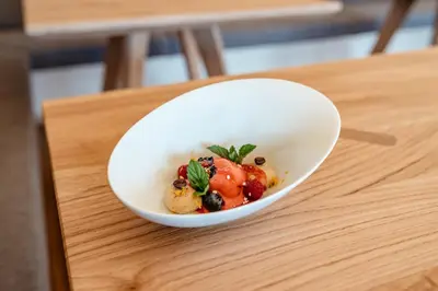 a bowl of food sitting on a table at Oberhauser Hütte Rodenecker - Lüsner Alm in Luson