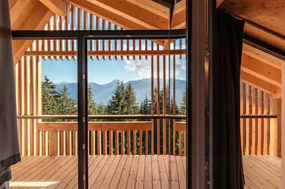a view from the balcony of a cabin with a view of the mountains at Oberhauser Hütte Rodenecker - Lüsner Alm in Luson