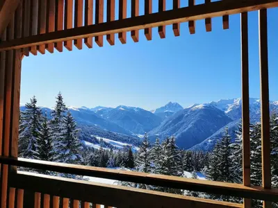 a window with a view of the mountains at Oberhauser Hütte Rodenecker - Lüsner Alm in Luson