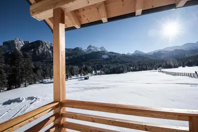 a view from a cabin window of a snow covered field at Les Pizades in San Cassiano
