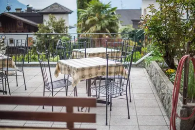 a table and chairs sitting on a patio at Garni Stübele in Tirolo
