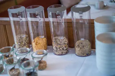 a group of glass vases filled with different kinds of nuts at Garni Stübele in Tirolo