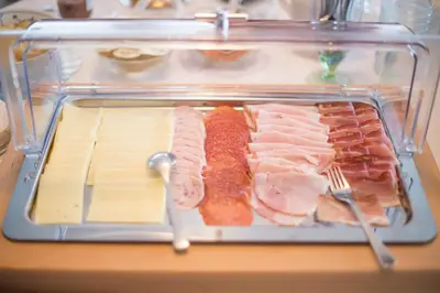 a plastic container filled with different types of meat and cheese at Garni Stübele in Tirolo