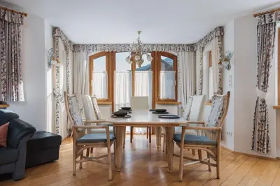 a dining room with a table and chairs at Alpenvilla Large Family Apartment - by Familiaris- Pools 500 meters in Valdaora