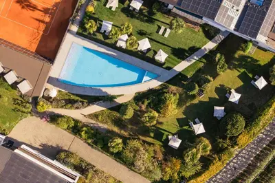 an overhead view of a yard with a swimming pool at Appartement KroneLiving in Tirolo